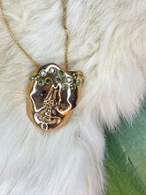 Gold plated face necklace