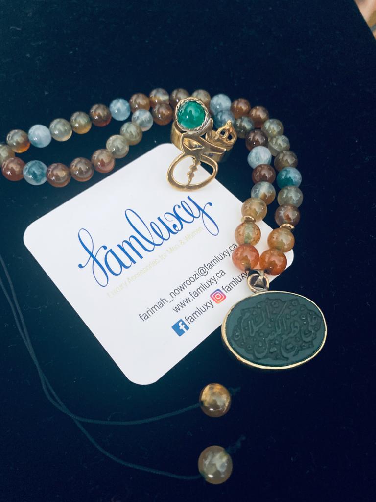 Calligraphy necklace with jade stones