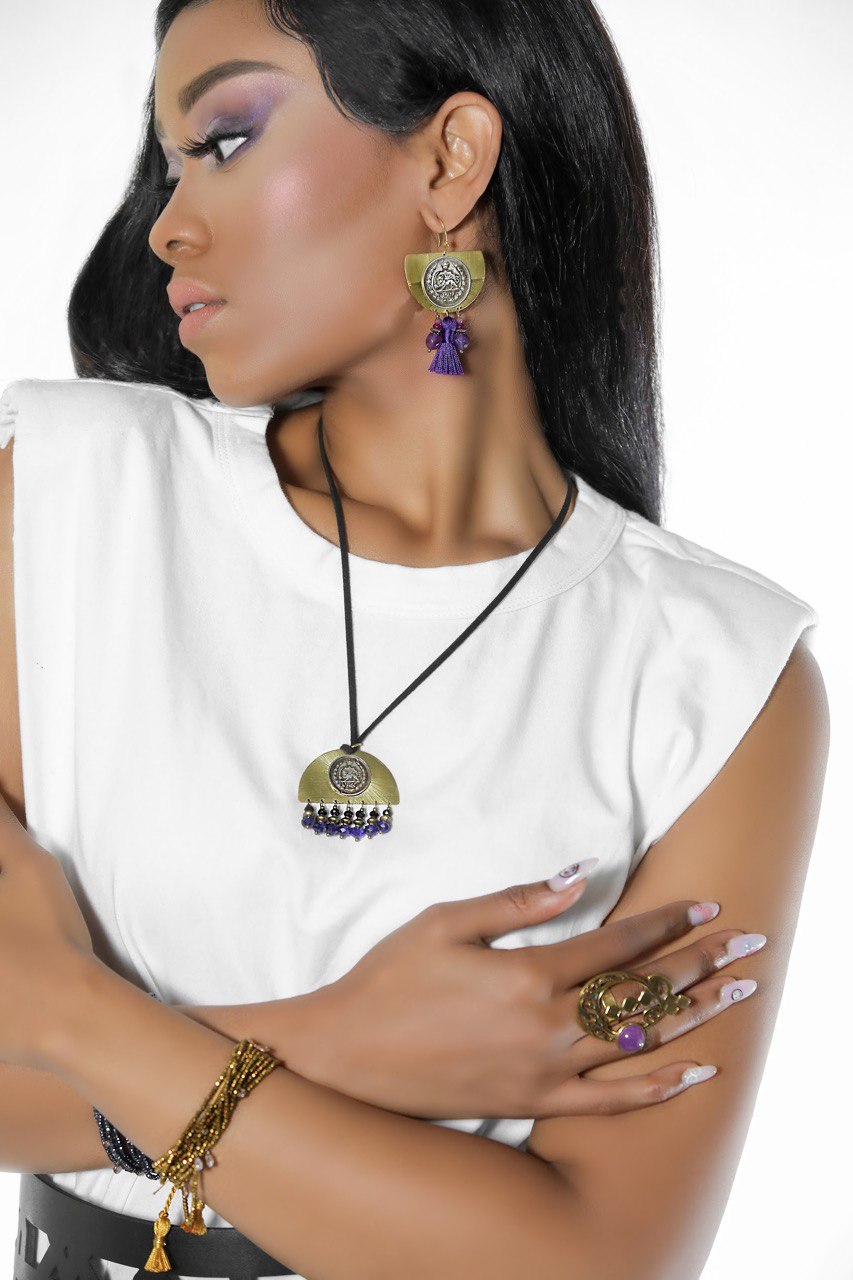 Handmade original coins set with purple zirconia crystals